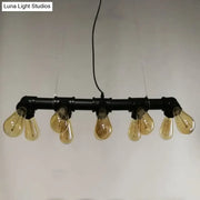 Industrial style ceiling light fixture featuring black metal piping and five amber glass filament bulbs for dining room use