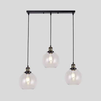 Black metal industrial style brass pendant light kit with three clear glass globe round barn admix hanging lamps