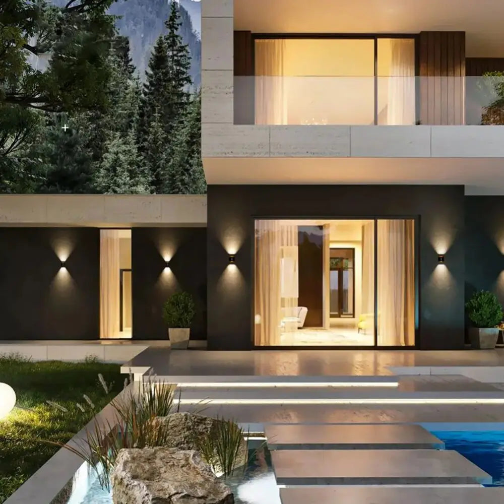 Modern minimalist house with sleek concrete and dark wood exterior illuminated by warm decorbites™ ip65 led outdoor wall lights
