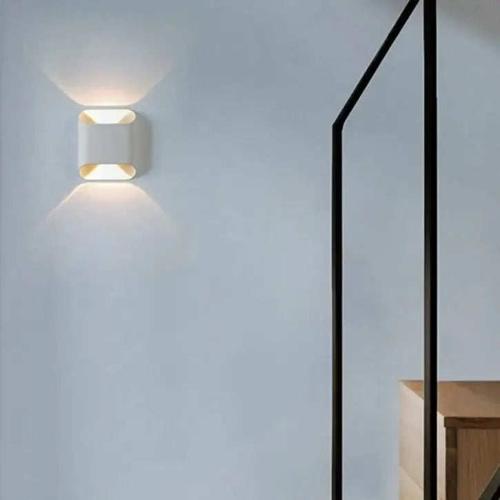 Modern white rectangular decorbites™ ip65 led outdoor wall light with warm angled illumination for exterior spaces