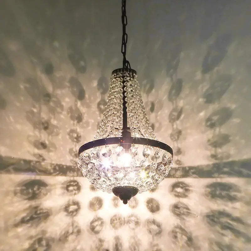 A decorbites iron art crystal chandelier dining room light with sparkling crystals and black iron frame hanging chain