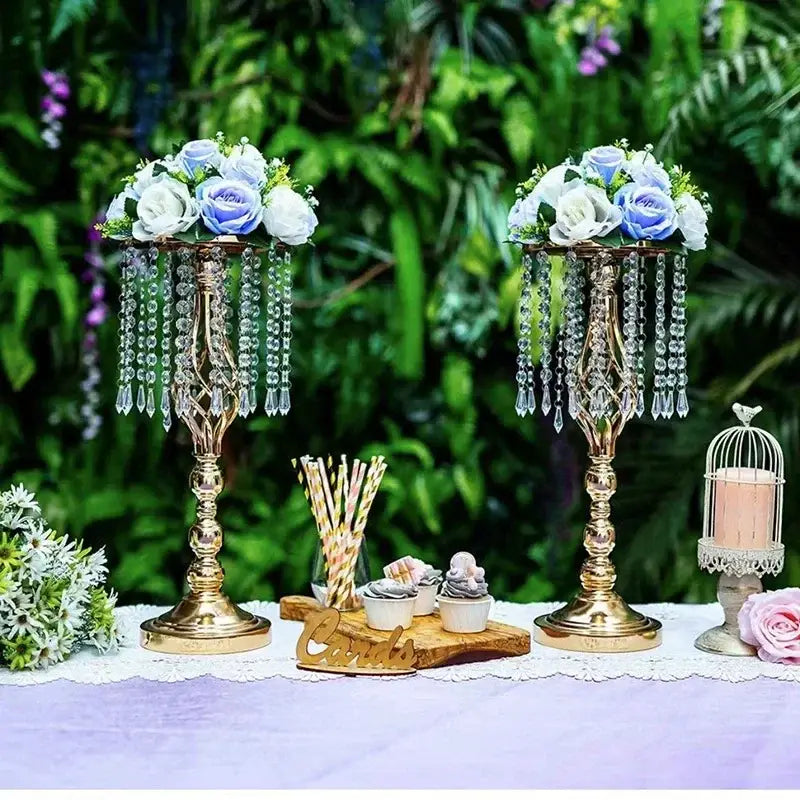 Gold-colored crystal chandelier-style iron flower rack centerpiece with cascading beads and white light blue roses for dining table decoration