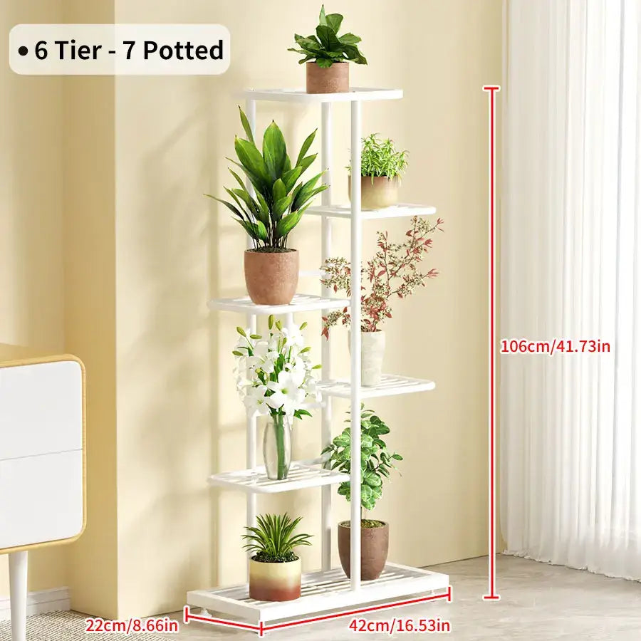 DecorBites™ white iron plant stand with six slatted shelves holding seven varied potted plants for indoor decor