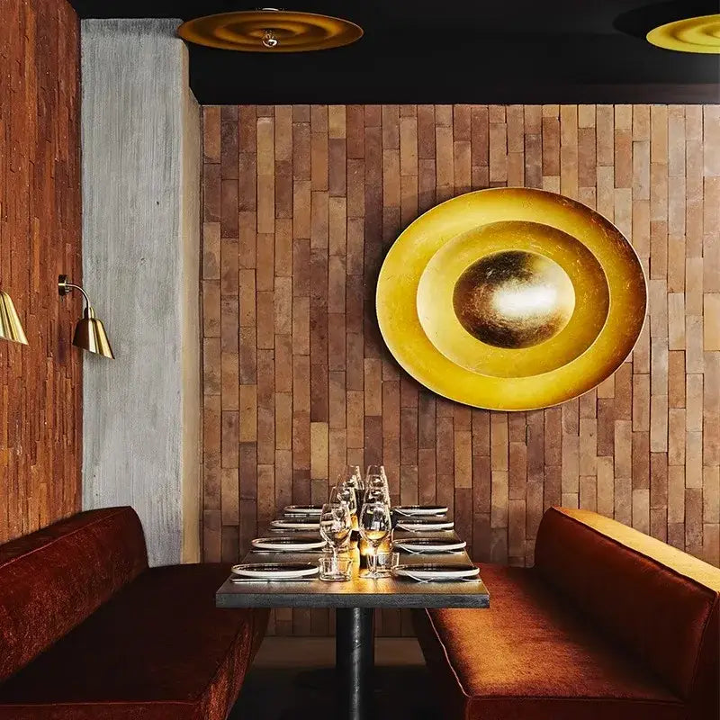 Decorbites italian vintage gold-toned textured wall sconce with concentric rings and reflective center for living room