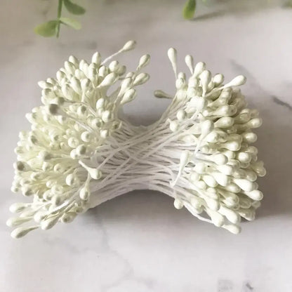A bundle of decorbites ivory flower cherry stamen berries with delicate white paper flowers for wedding decor