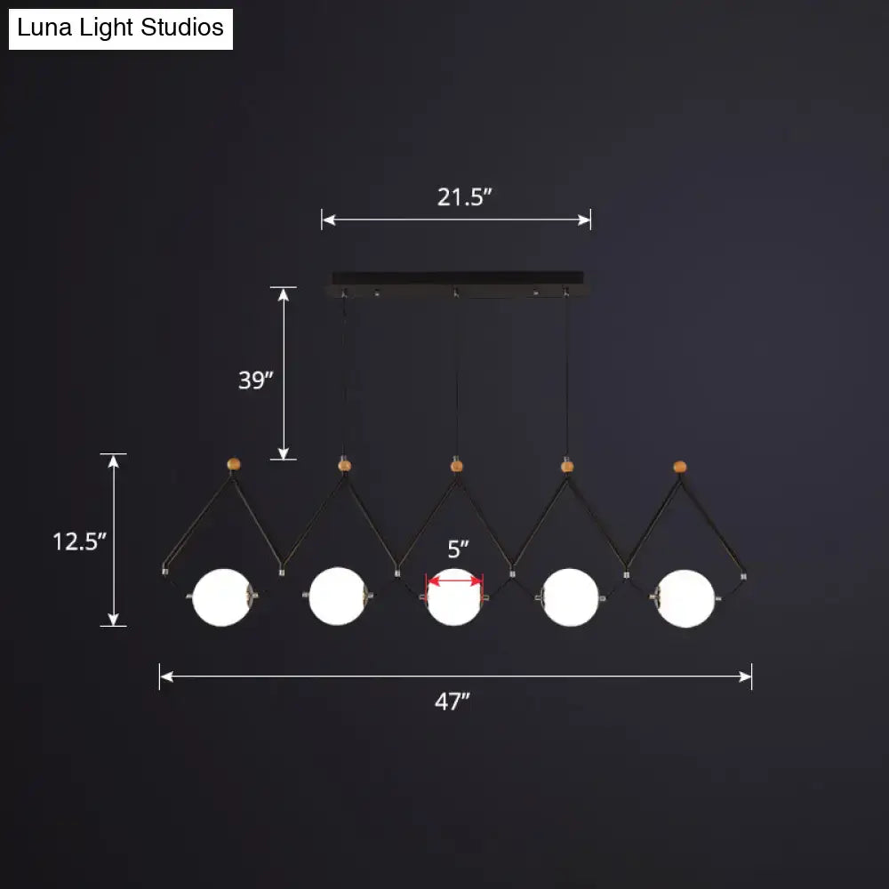 Black metal suspension light with five ivory glass spherical bulbs on angled arms for restaurant suspension light use