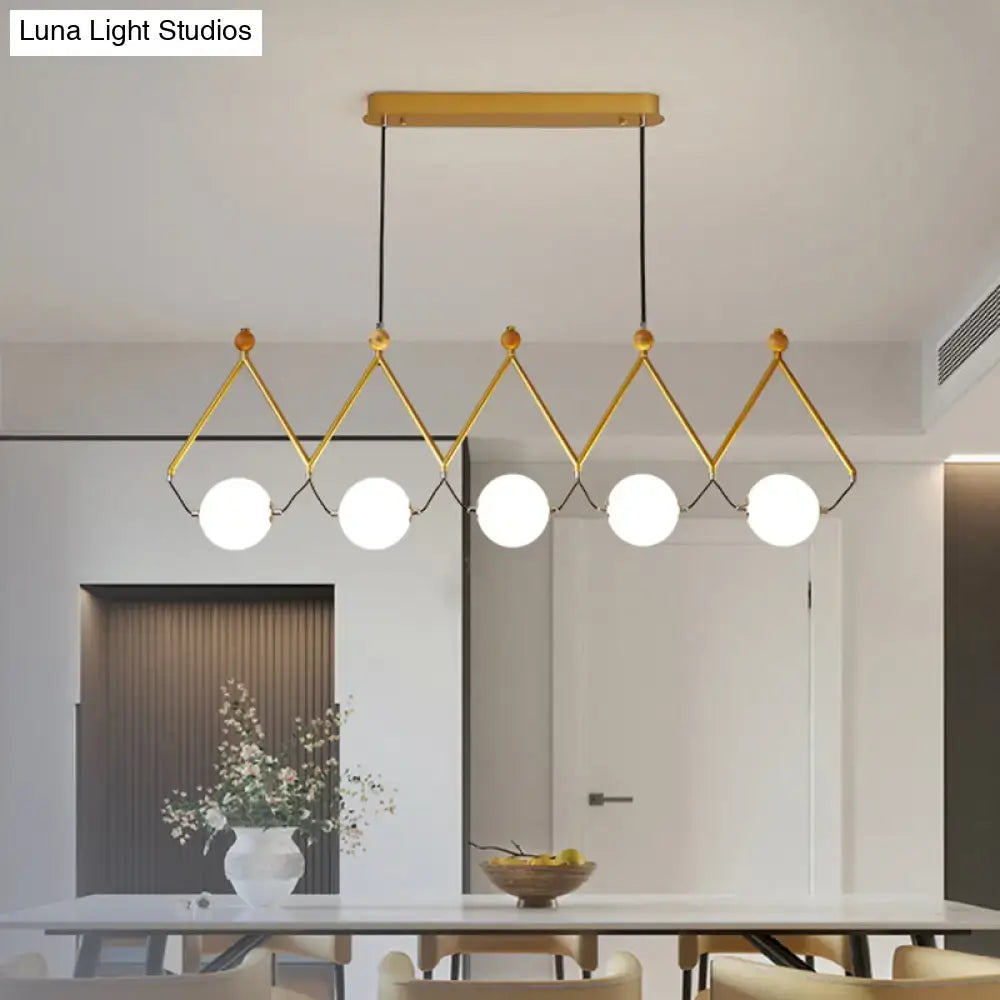 DecorBites ivory glass minimalist ball suspension light with gold-toned geometric frame and white glass bulbs sale