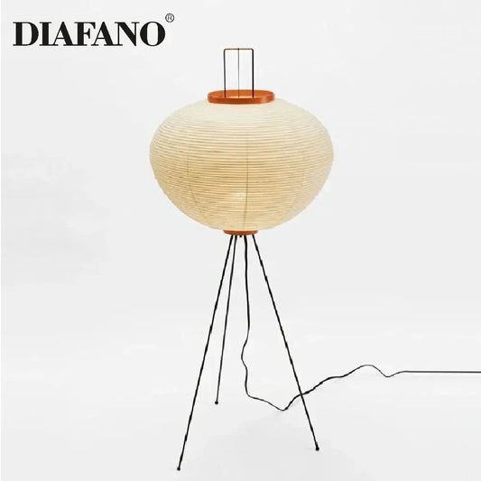 Diafano floor lamp with a cream japanese style paper lantern shade and black metal tripod legs for living room lighting