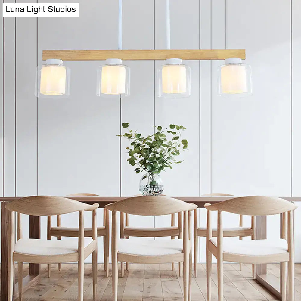 Light wood bar pendant light with four clear white glass cylinder shades for dining room glass cylinder led island fixture