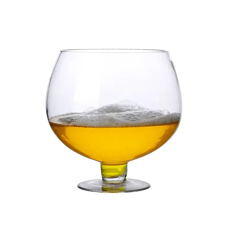 A clear glass decorbites jumbo party glass filled with golden beer and topped with a frothy white head
