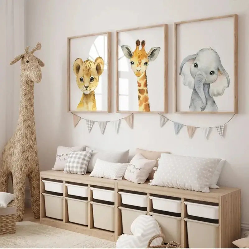 Set of three framed pastel watercolor animal nursery wall art prints featuring a lion cub giraffe and elephant by DecorBites