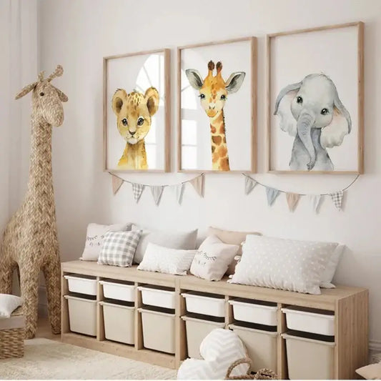 Set of three framed pastel watercolor animal nursery wall art prints featuring a lion cub giraffe and elephant by DecorBites