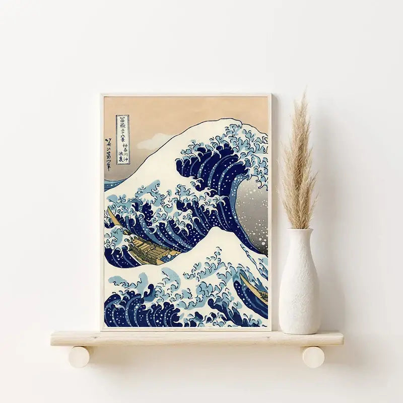 A framed print of katsushika hokusai blue waves in a light wood frame with traditional japanese calligraphy
