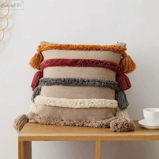 Beige woven decorbites knit boho cushion cover with horizontal orange red gray cream stripes and tassels for living room