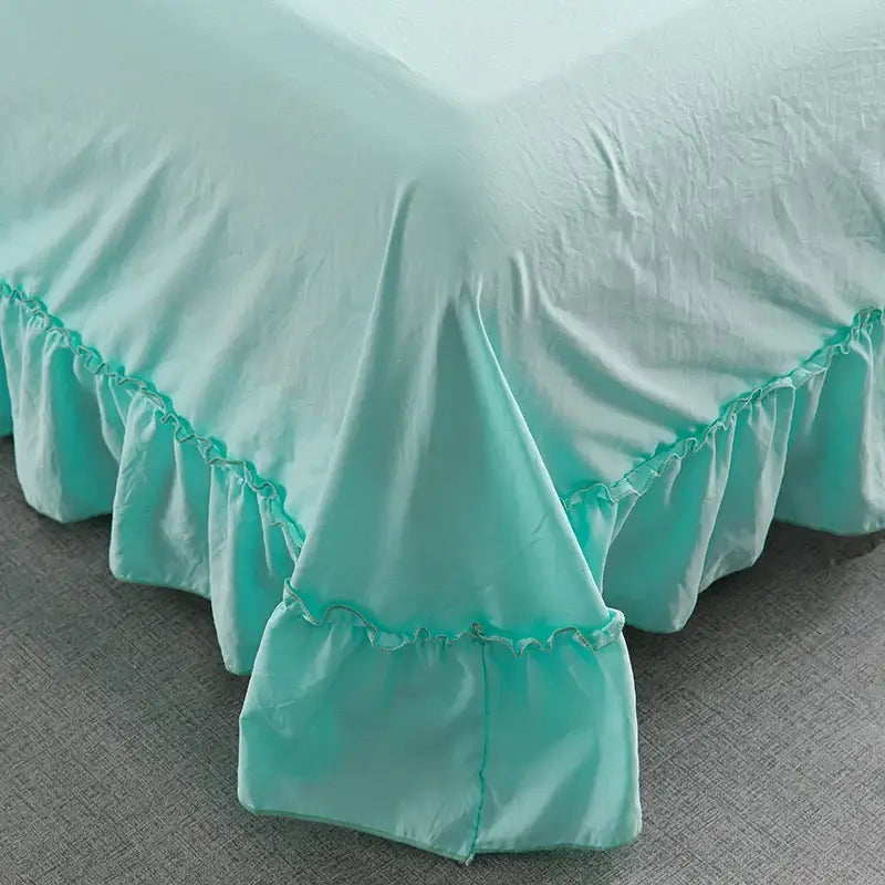 A soft mint green ruffled bed skirt with delicate gathered hemline from decorbites korean princess ruffles quilt set