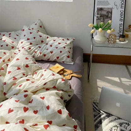 Cream-colored korean style duvet cover bedding set with red heart pattern made from soft cotton fabric by DecorBites