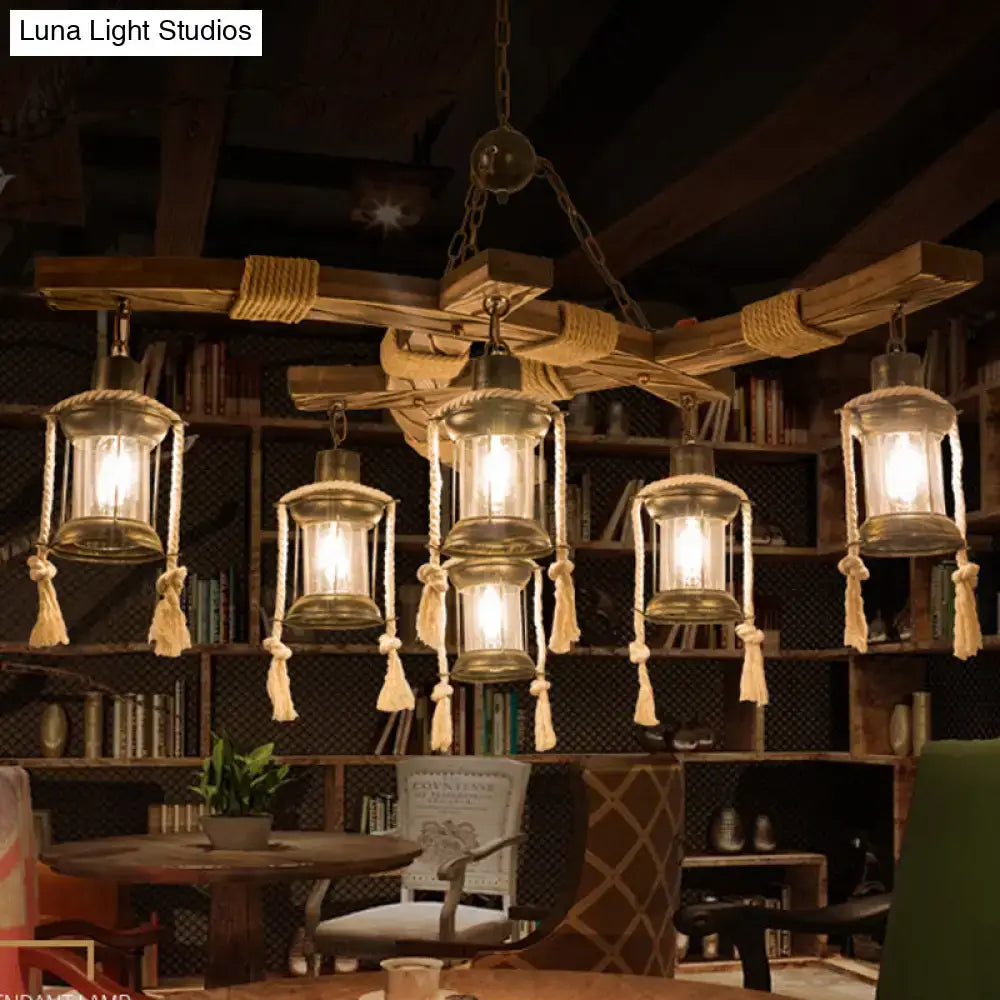 Rustic wooden chandelier with five lantern-style lights featuring clear glass panels and beige rope detailing for led incandescent use