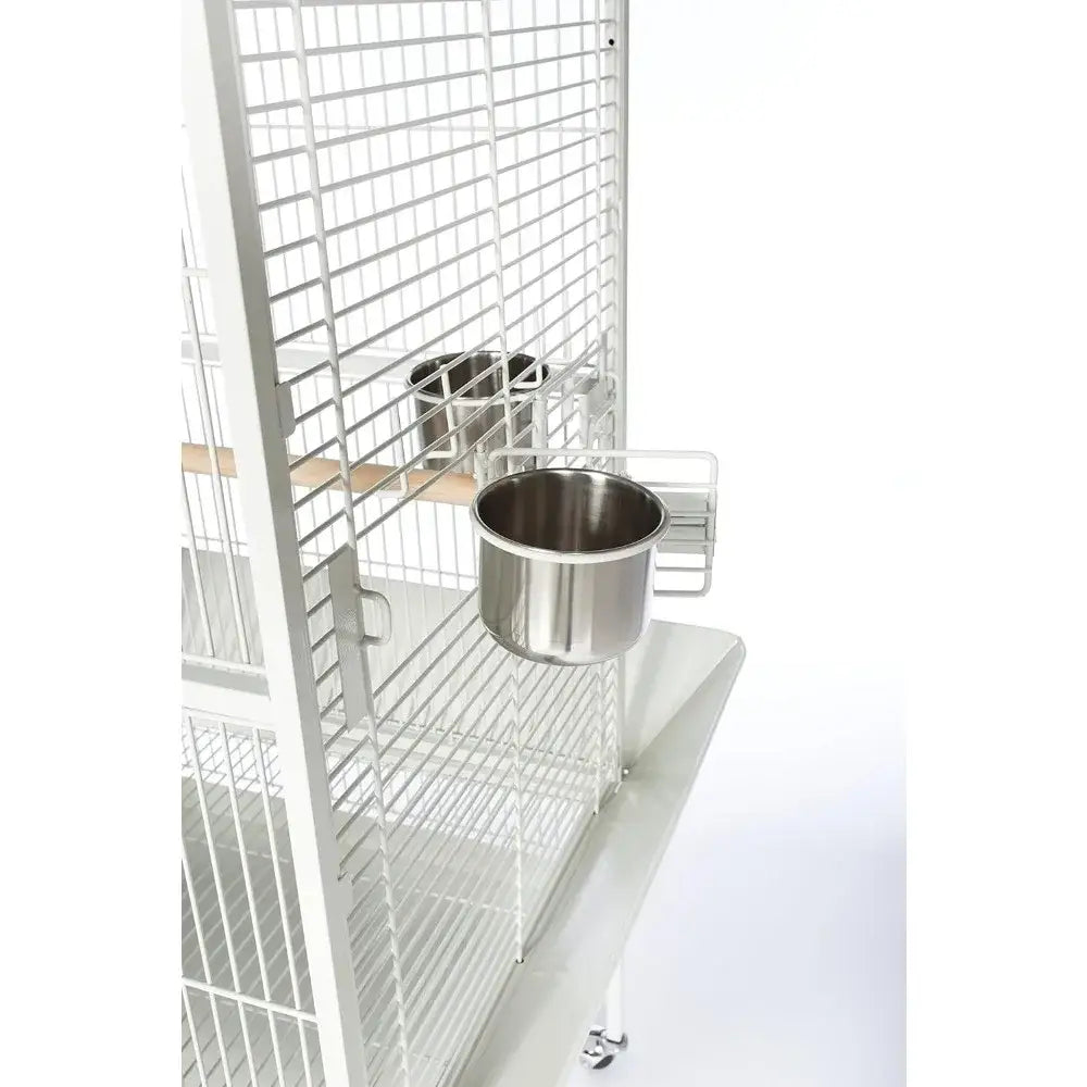 Silver stainless steel bird feeder mounted on large chalk white decorative bird cage by decorbites