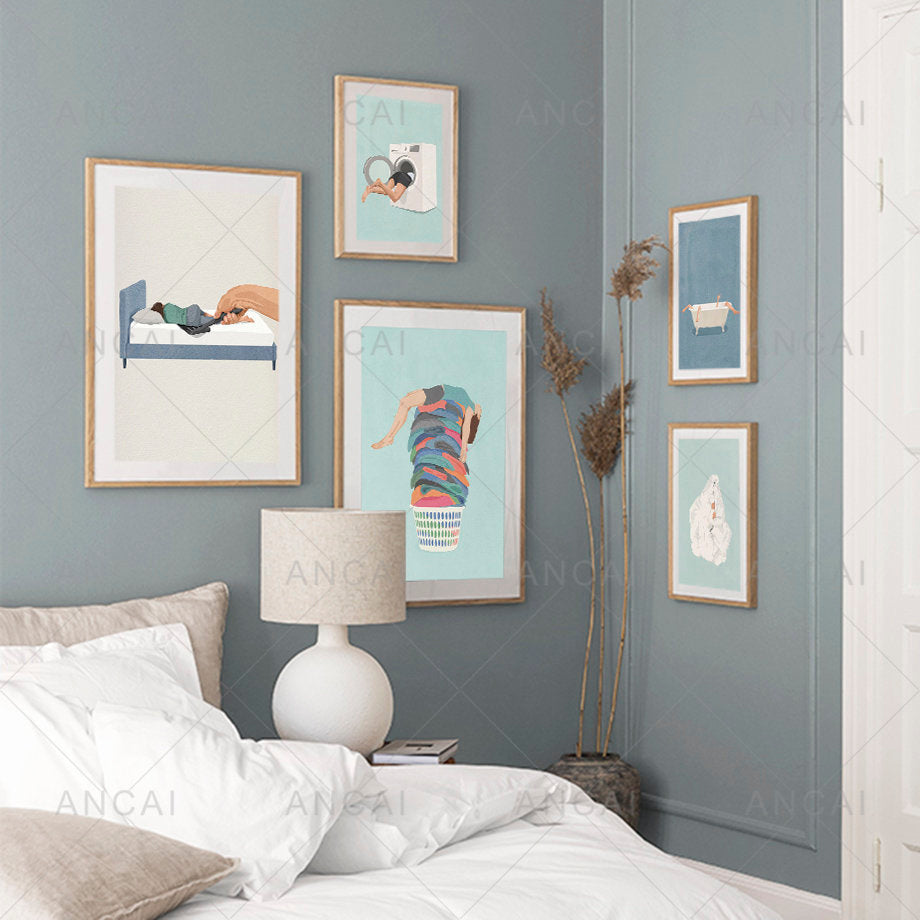 Set of five framed laundry girl wall art prints with pastel backgrounds in light wood frames for Nordic home decor