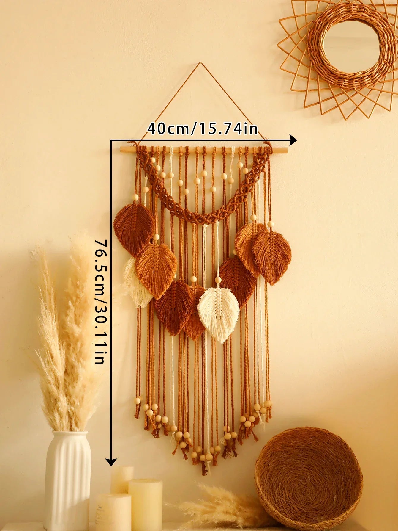 A decorbites™ macrame wall hanging with woven leaf accents in brown and cream tones on a wooden dowel