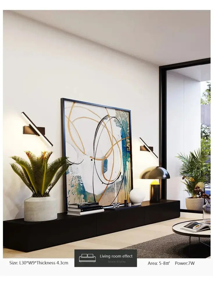 Modern living room with decorbites™ led black rechargeable 330 rotated wall sconce featuring usb type-c and remote control light source