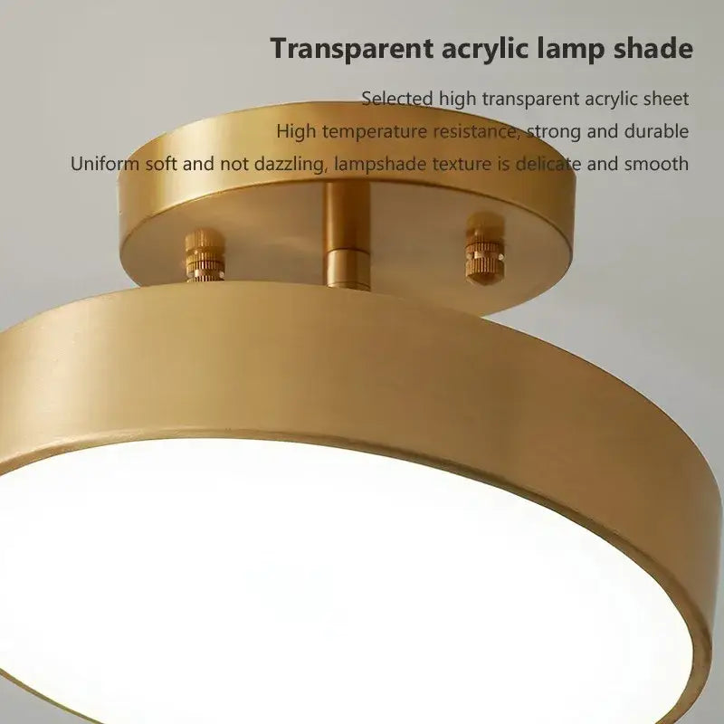 Gold-toned circular DecorBites™ led ceiling light with transparent acrylic shade for bedroom and living room use