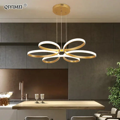 Gold-toned decorbites led ceiling light featuring a modern flower-like design with interlocking rings for living rooms