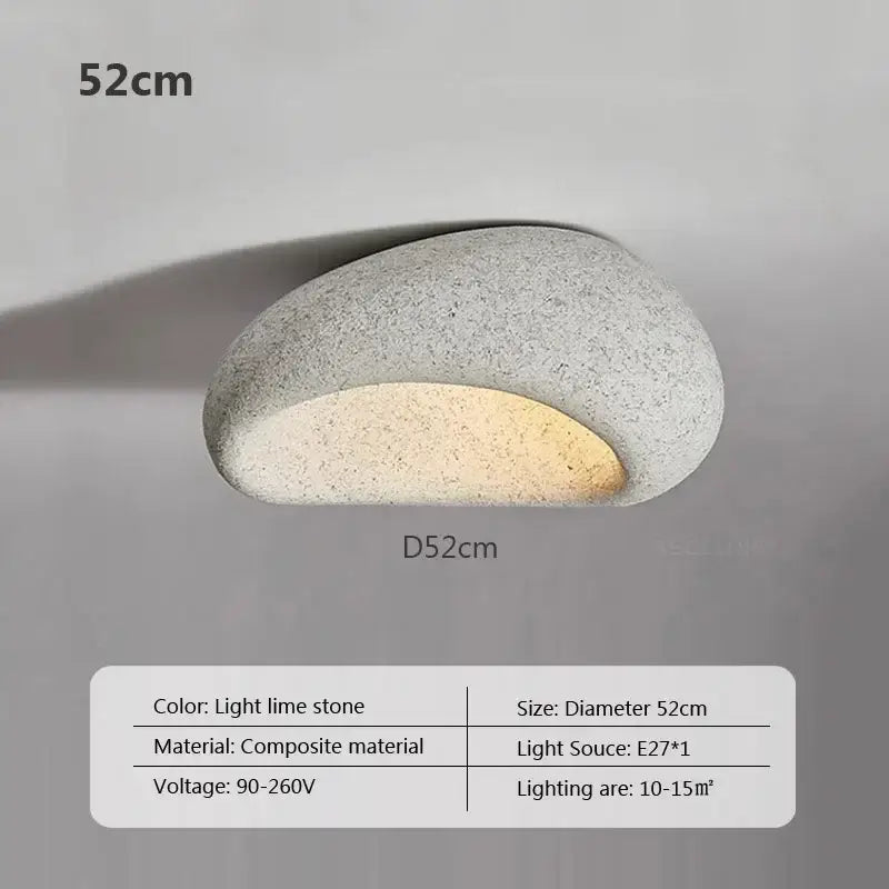 Decorbites led ceiling lights featuring sleek oval shape with textured lime stone finish and warm integrated glow for indoor use