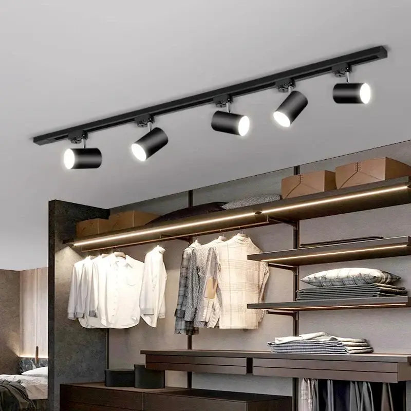 Black cylindrical decorbites led ceiling lights mounted on a ceiling rail for nordic home indoor lighting