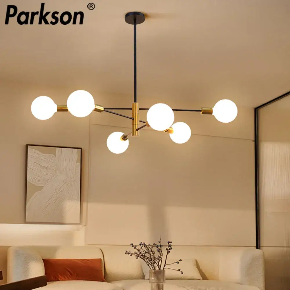 Parkson brand modern decorbites led ceiling light features five frosted glass bulbs on a black and brass metal frame