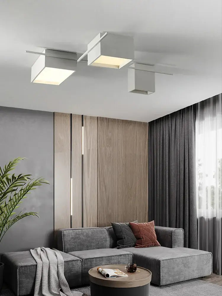 Modern minimalist DecorBites LED ceiling lights with three white acrylic panels and metallic arms for living room use