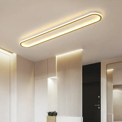 Modern gold-trimmed decorbites led ceiling light with sleek oval design emitting warm ambient illumination for home lighting