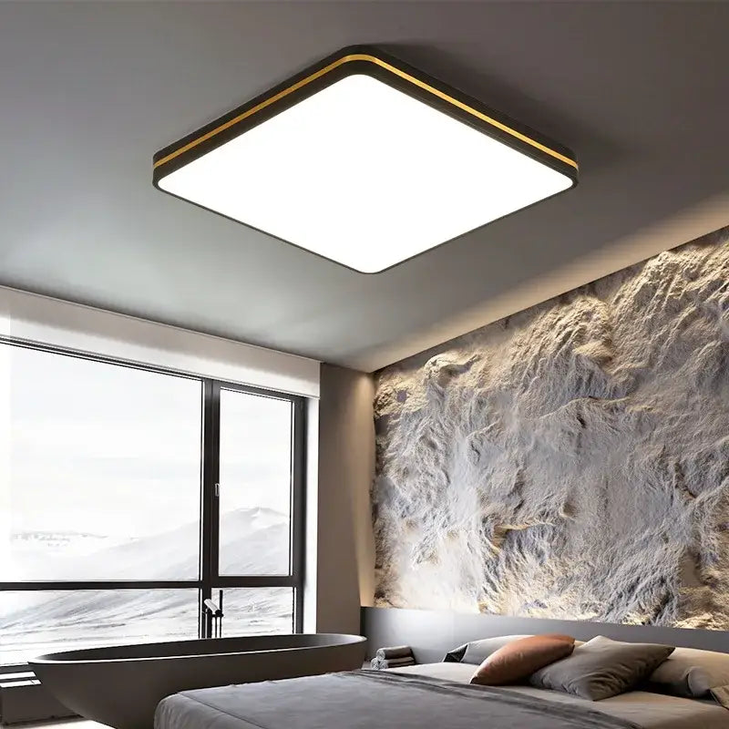 Modern decorbites led ceiling light with sleek black metal frame gold trim emitting bright white illumination