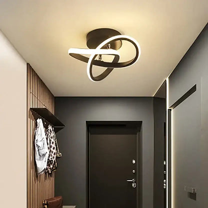 Modern black and white DecorBites LED ceiling lights with sleek intertwined ring design for living room and staircase