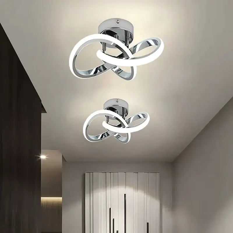 Modern chrome-finished DecorBites led ceiling lights with intertwined glowing white LED rings for living room and balcony