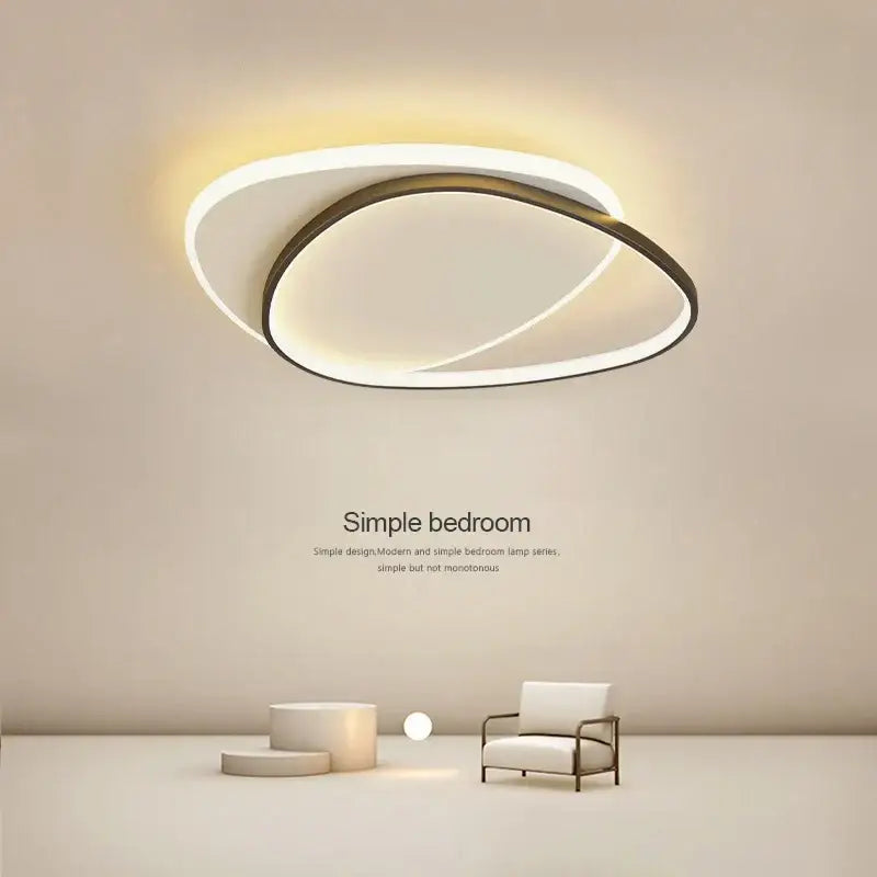 Modern decorbites led ceiling lights featuring two concentric oval rings in white glow and dark metallic frame for indoor use