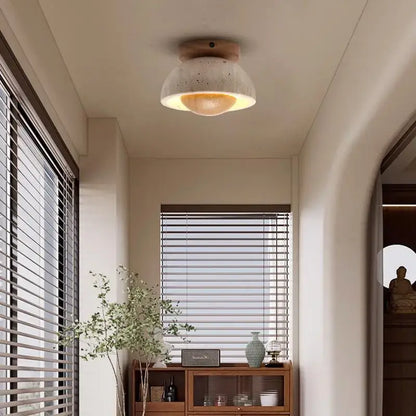 A warm-toned speckled concrete decorbites led ceiling light with wooden base in modern style for balcony living room