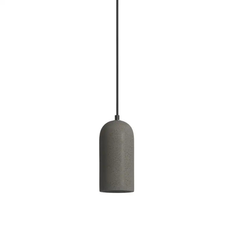 Gray concrete pendant light with sleek cylindrical design and black cord in decorbites led cement chandelier style