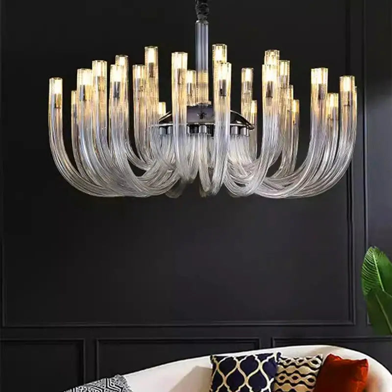 DecorBites led chandelier modern lighting fixture with clear curved glass arms and warm glowing lights for bedroom