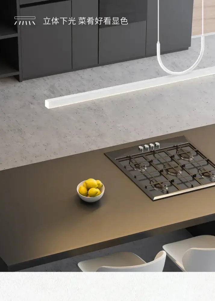 Decorbites™ led chandelier in nordic minimalist style above a kitchen island with matte bronze countertop and gas cooktop