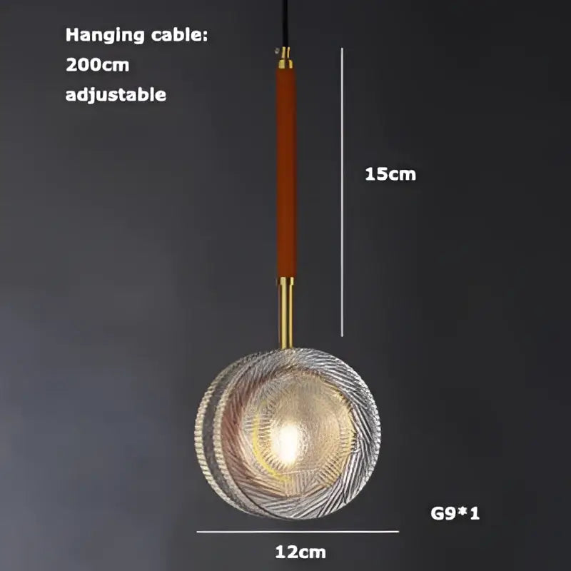 A modern glass decorbites led chandelier with circular textured design and warm golden glow for dining room lighting