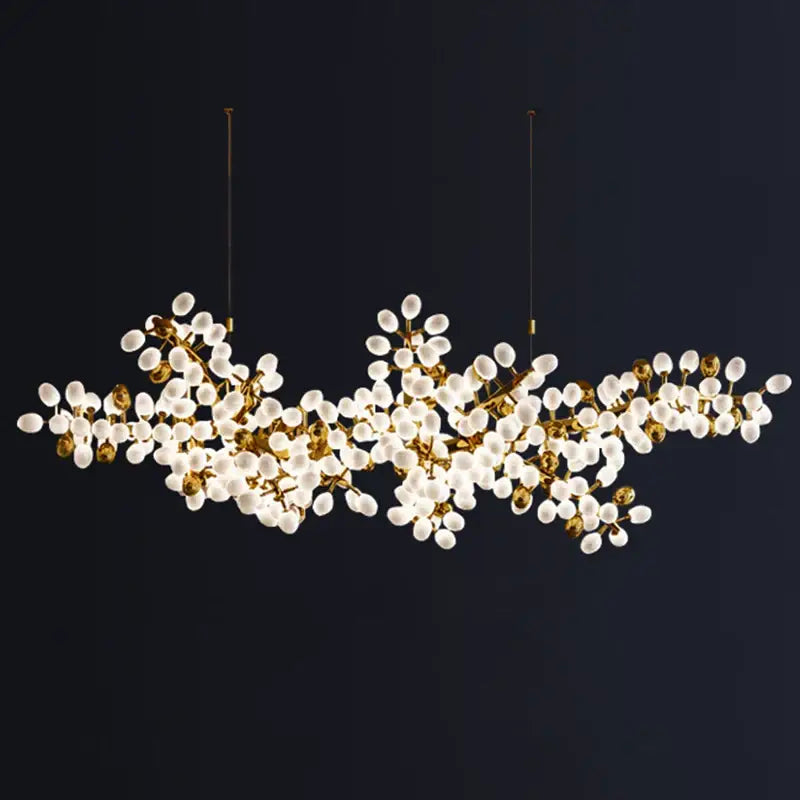 Gold-toned decorbites led chandelier with frosted glass globes in a branching design for living room and dining room lighting