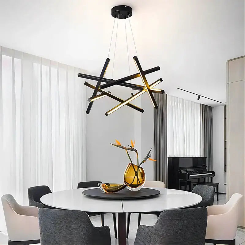 Modern black and gold geometric decorbites led chandelier lighting with intersecting rods for indoor living and dining spaces