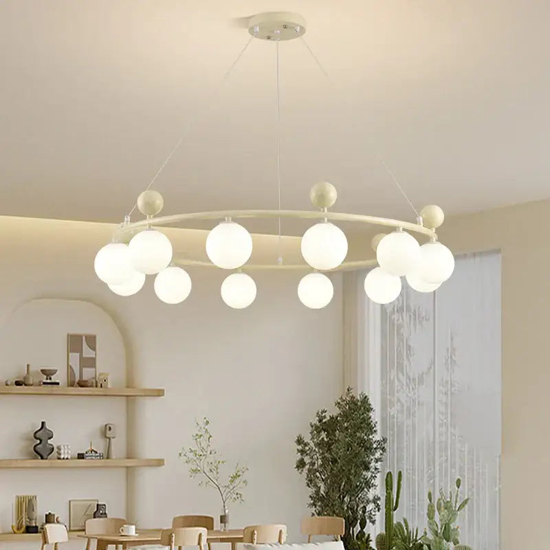 Modern off-white decorbites led chandelier with frosted glass globe bulbs and minimalist metal frame for indoor lighting