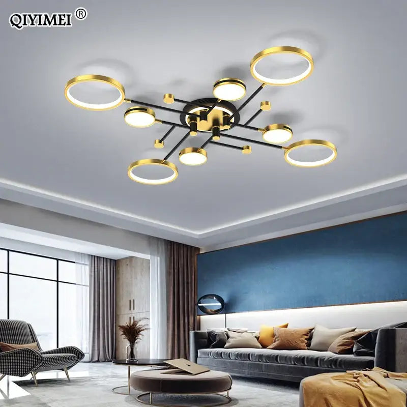 Gold-toned decorbites led chandelier lights with circular rings and black arms modern dimmable chandelier lights