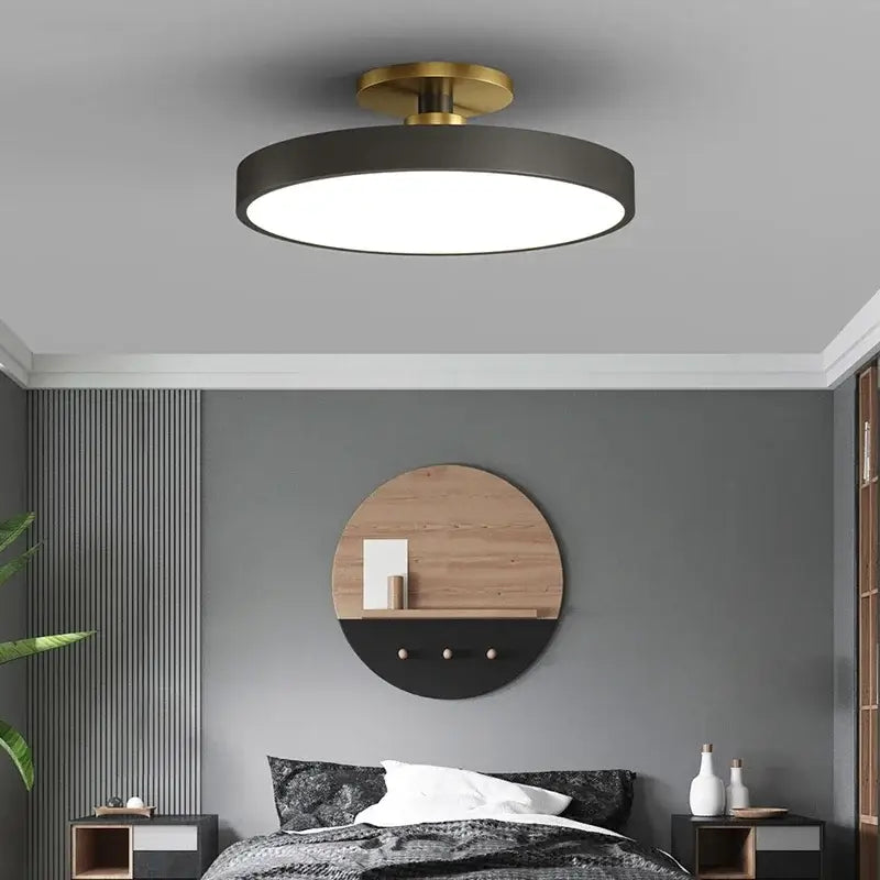 Modern black circular led chandelier light with brass-finished central mount for home living and study decor