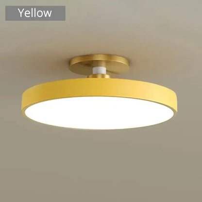 Yellow circular led chandelier light with gold-toned metal base for modern indoor home and bedroom lighting by DecorBites