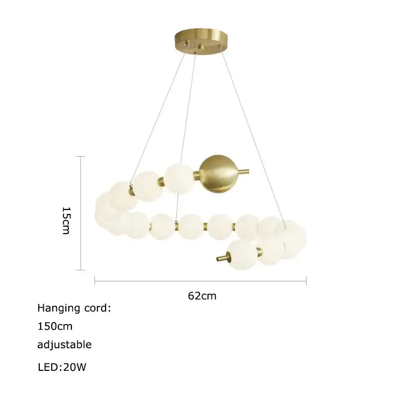 A modern brass-finished decorbites led chandelier with frosted glass spheres in an asymmetrical spiral design for dining room