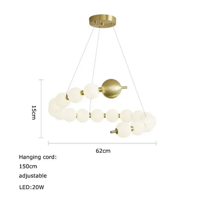 A modern brass-finished decorbites led chandelier with frosted glass spheres in an asymmetrical spiral design for dining room