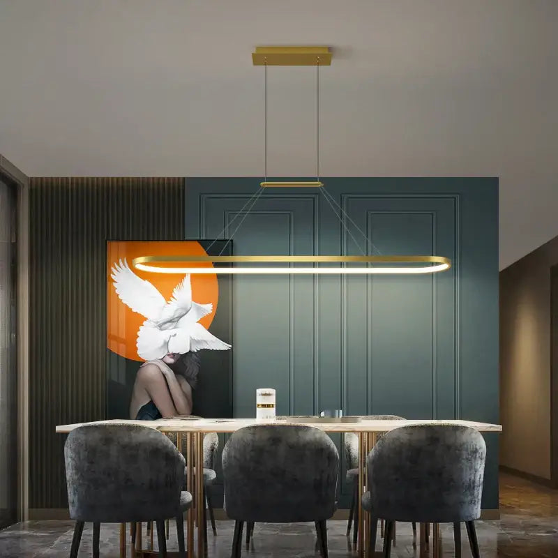 Gold rectangular pendant light with sleek modern design hanging above dining table decorbites led chandelier pendant